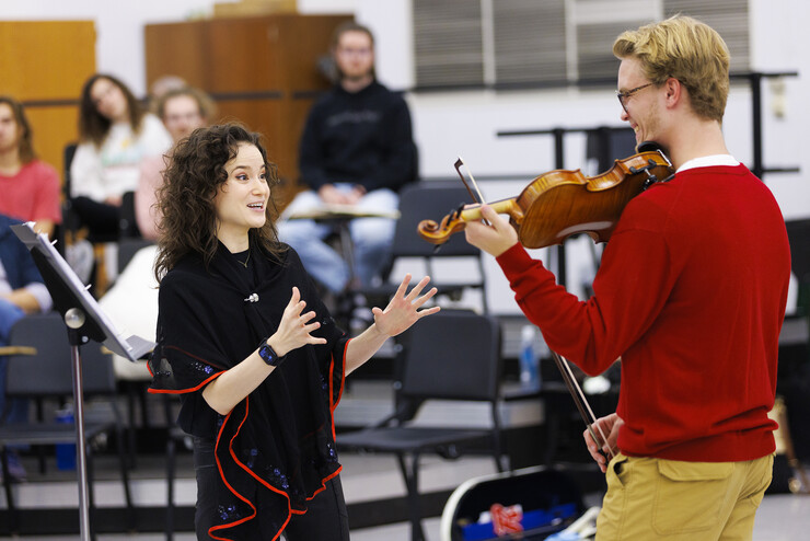 Sandy Cameron instructs Iain Thomas, a junior music major, during the master class for strings students Oct. 4.
