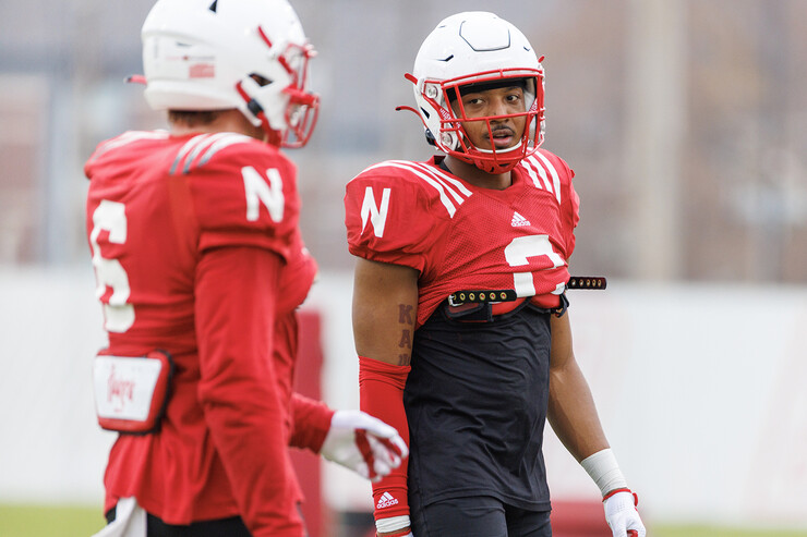 Darius Moore (right) talks with a fellow Husker during practice on Nov. 9.