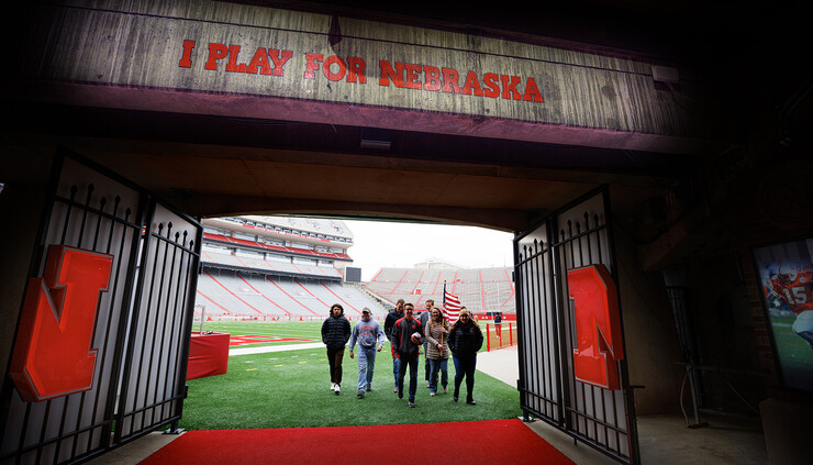 Volunteers walk out of Memorial Stadium following the ceremonial start to the 2022 Things They Carry Ruck March on Nov. 15.