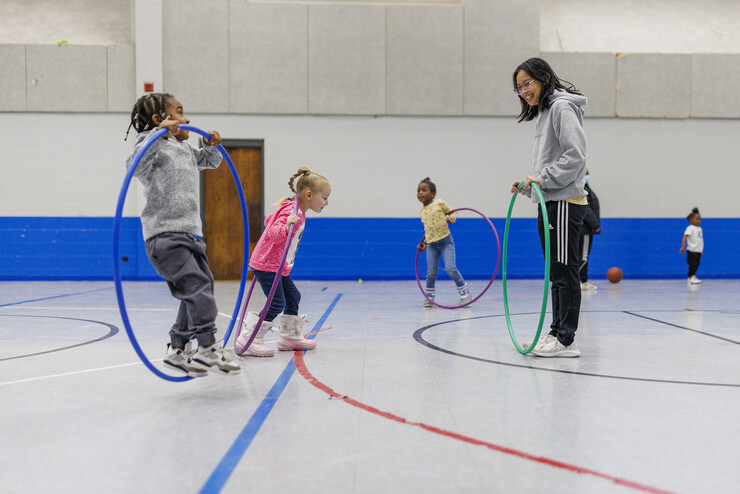 Delta Phi Lambda member Aliyah Muniz plays with the children at the Malone Center.