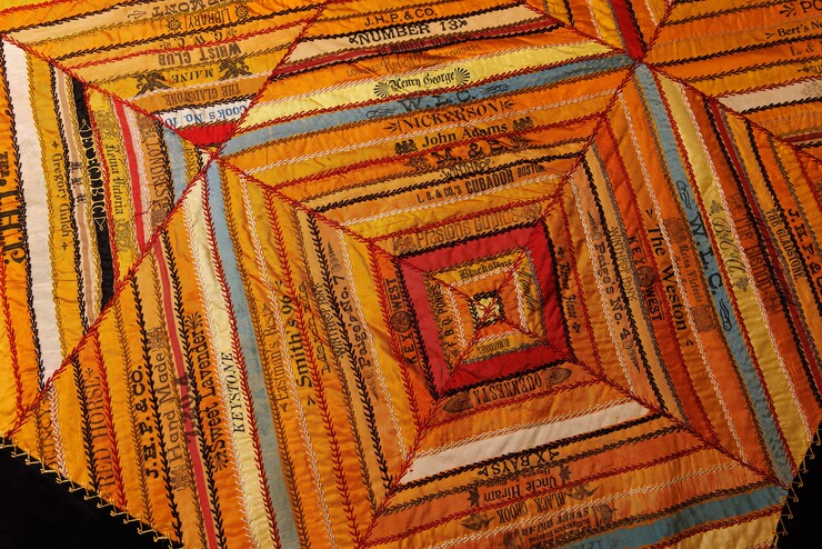 up close image of quilts made from cigar ribbons