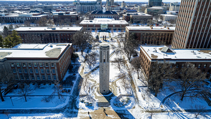 Aerial view of a snowy campus, looking south over the plaza from Mueller Tower to Love Library North on Feb. 17.