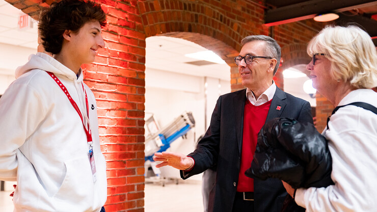 Chancellor Ronnie Green greets a prospective Husker and his mother inside the Coliseum during Admitted Student Day on March 25.