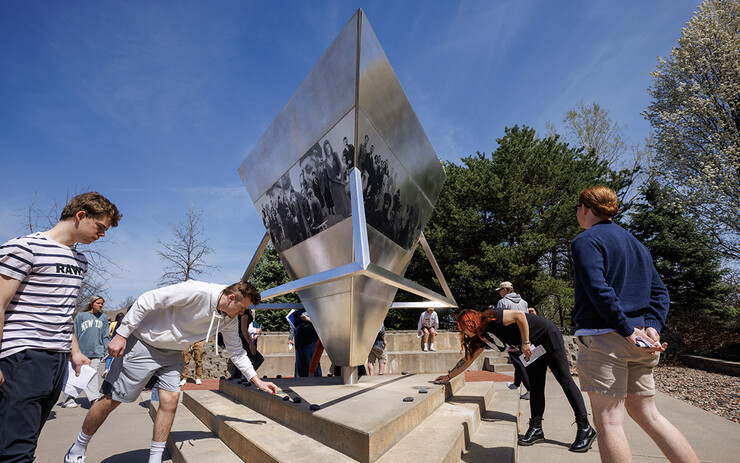 Students place rocks on the Holocasut Memorial. In Jewish cemeteries the tradition is to place rocks on the grave rather than flowers. History of the Holocaust course students visit the Holocaust memorial in Lincoln’s Wyuka Cemetery.