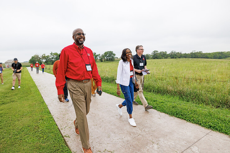 Chancellor Bennett and wife, Temple, walk a path. 