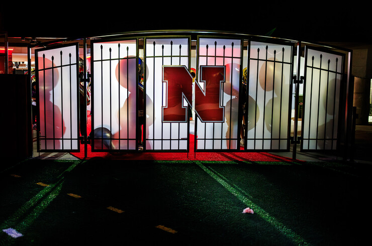 The shadows of the souzaphone players fall on the tunnel walk doors during their 6:30 am section practice.