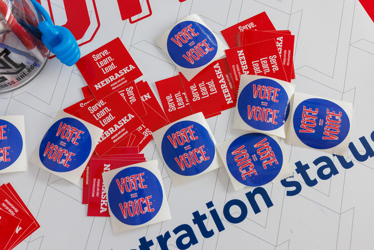 The Husker Vote Coalition hands out stickers and voting information.