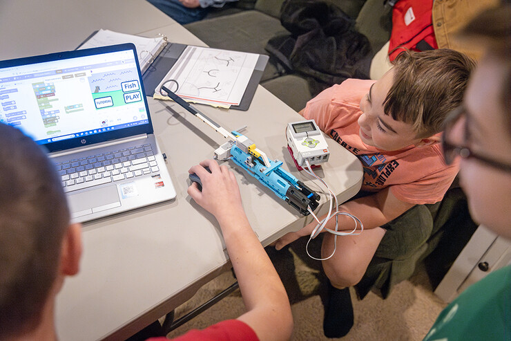 FIRST LEGO League members work on a video game for their research project for this year's competition.