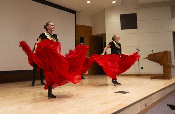 A group of four students from Columbus High School wear flamenco skirts as they dance to a Cuban folk song.
