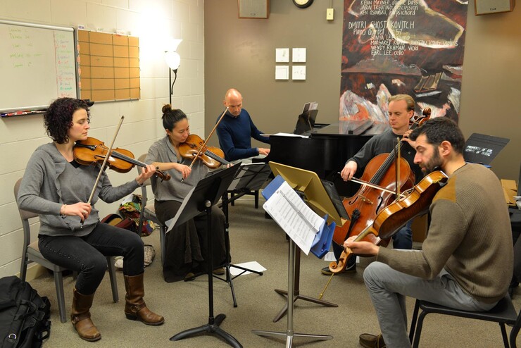 Paul Barnes practices with the Chiara String Quartet in preparation for the upcoming "Celebration of Philip Glass."