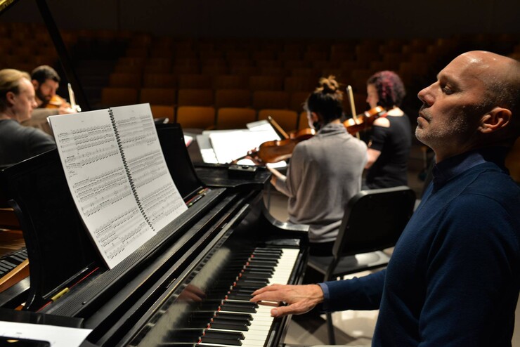 Paul Barnes reacts during a rehearsal for the upcoming "Celebration of Philip Glass."