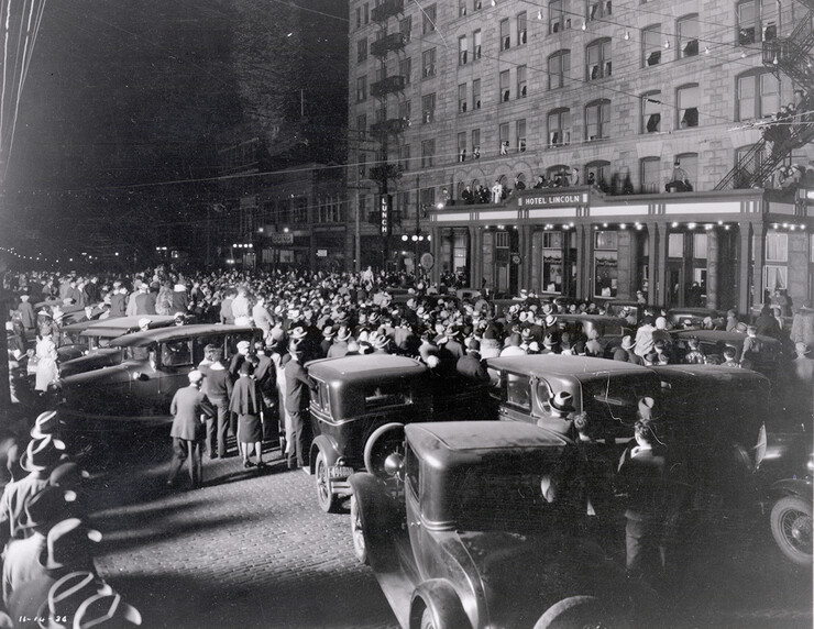 Husker fans gather outside the Hotel Lincoln the night of Nov. 14, 1930 ahead of a Big Six football matchup between Nebraska U and Missouri.