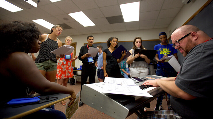 Students practice a song for the musical "Chrysalis" in UNL's Military and Naval Science Building on June 21. The festival, which is June 20-25, is making use space in 24 UNL buildings this year. Also, participants are housed in nine City Campus residence halls.