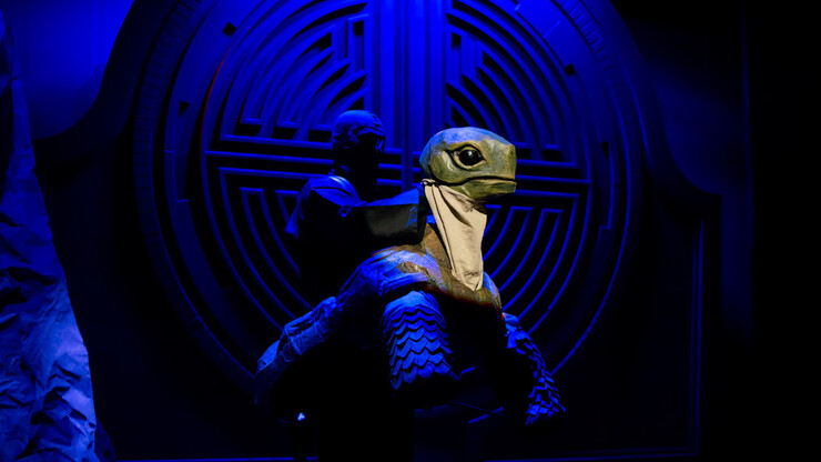A student operates a turtle puppet during a Feb. 22 dress rehearsal for "The Way to the Way."