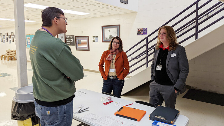 Ken Bartling, right, chats with a prospective voter at a voter registration event held at Grand Island Senior High on October 18th, 2022, partnered with GI Deputy Registrar and GIPS Board President Lisa Albers, left.