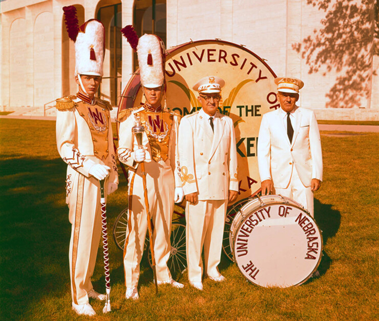 Cornhusker Marching Band leaders standing around the drum outside Sheldon Museum of Art in this undated photo.