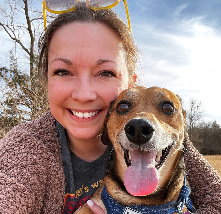 Carly Buser and her dog, Murphy, pose for a selfie while outside.