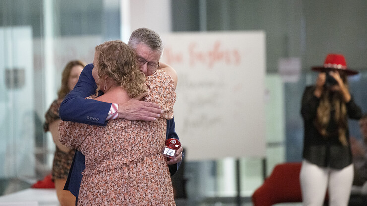 Tom Field hugs Vickie Ference, a junior in ag education. Ference won the "Fire In The Belly" award named for Paul Engler's belief that the secret to successful entrepreneurship was to have “a fire in the belly” to find a better way of doing things.