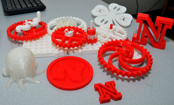 A sample of items that can be already be created on Print Services’ new 3-D printer. The gear system was crafted by Marissa Clow based on an online design.