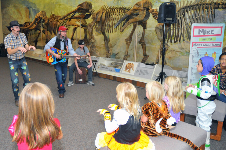 The family-friendly band Mike and the Mighty Magic Pants sing to children during the Oct. 24 Fright at the Museum event.