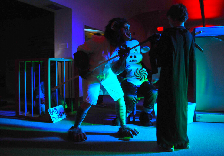 A group of bad monkeys try to spook a visitor on the third floor of Fright at the Museum.