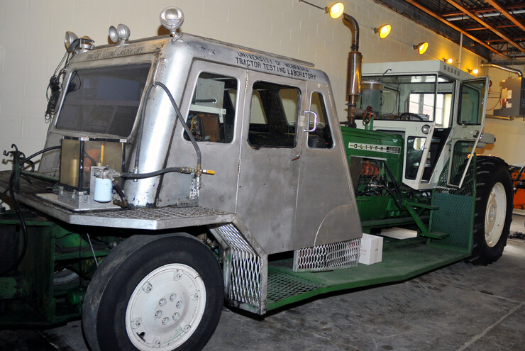 A recent addition to the Larsen museum is the first test car used at the Nebraska Tractor Test facility. The car (silver, at left) is connected to a more recent tractor. Instruments in both were used to gauge the quality of tractors tested at the UNL facility.