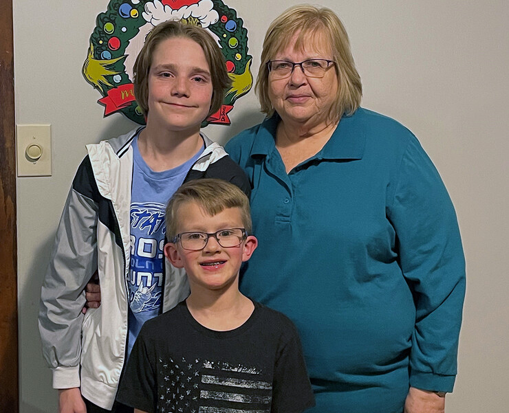 Nebraska's Cindy DeRyke poses with her grandchildren.