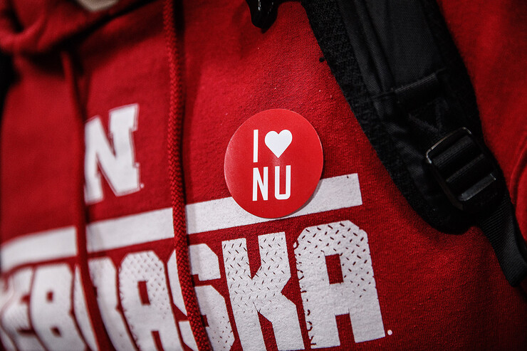Nebraska sweatshirt with an I Love NU sticker.