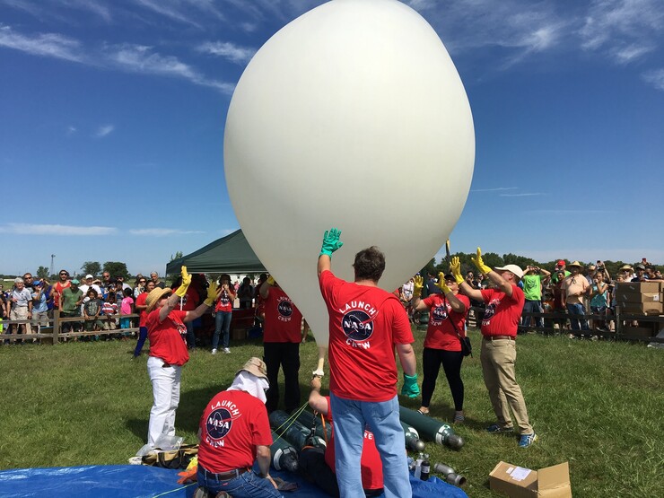 Members of the high-altitude balloon research team ready an eclipse-day launch at the Sturh Museum in Grand Island.