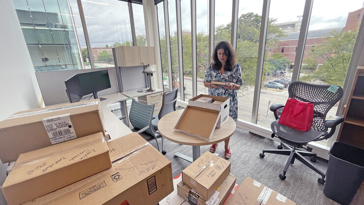 Nebraska’s Loukia Sarroub searches through a box of books in her new Carolyn Pope Edwards Hall office. Located immediately north of the corner of 14th and Vine streets, the new hall will open this fall. It is named for Edwards, a faculty member at Nebraska for 18 years. Her life mission was raising the quality of young children’s education by understanding how they develop and thrive cognitively, socially and emotionally.