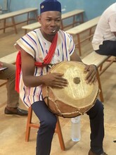 A teacher participant plays a drum during an exercise on griot-style storytelling at Malgoubri's workshop. Griots are a class of storytellers who share the stories of people and communities using melody, rhythm and repetition, often set to instruments.