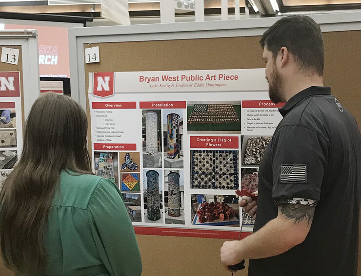 Luke Keilig presents his UCARE art project during the Research Fair.