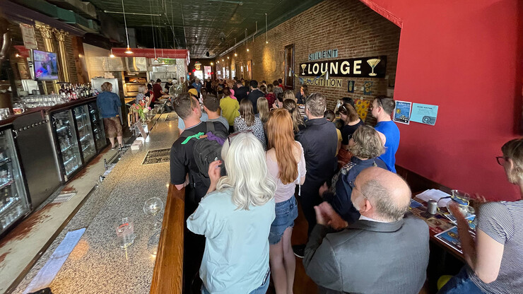 It was standing room only for those attending the UNL for Ukraine fundraiser on April 27 at Yia Yia's. Here, participants clap as a Ukrainian living in Lincoln discussed recent events and thanked the community for continued support.