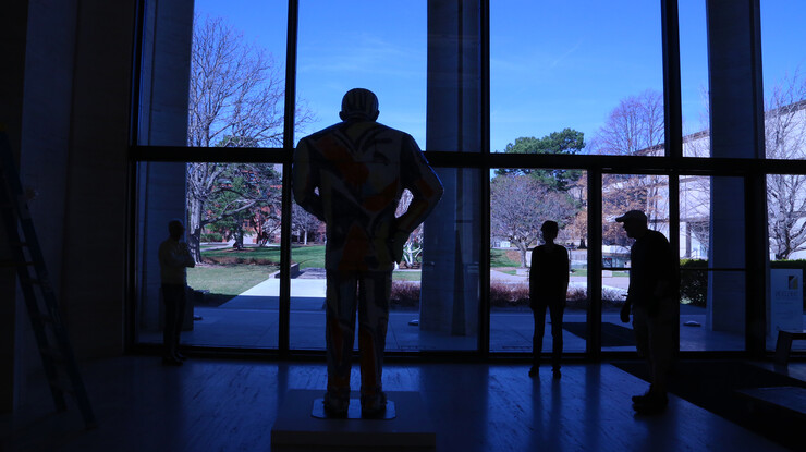 "Handout Man" gazes out the west windows at UNL's Sheldon Museum of Art.
