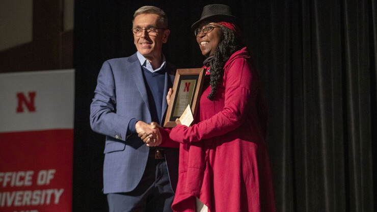Chancellor Ronnie Green (left) poses with Lori Dance during the Fulfilling the Dream Award presentation. Dance earned the honor for her years of service on campus and in the community.