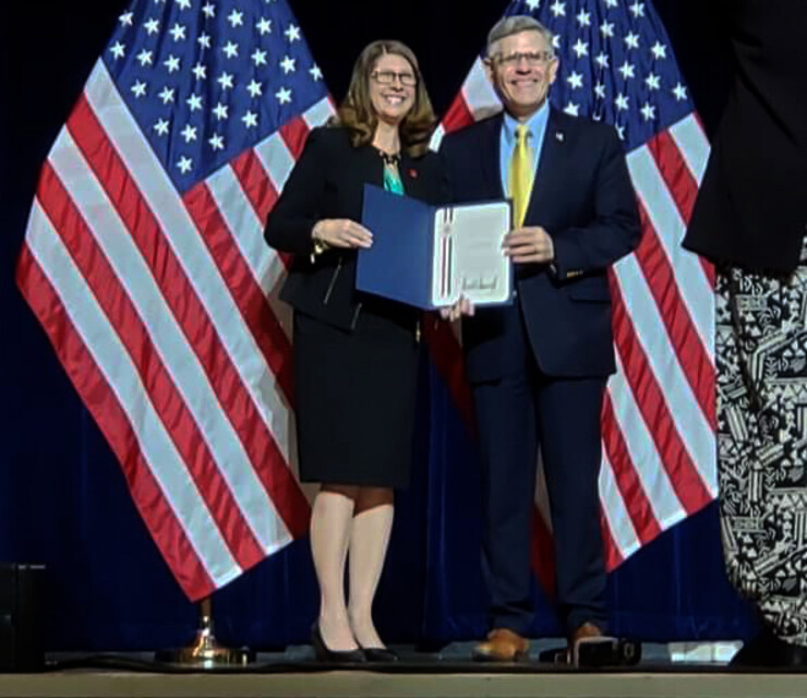 Angela Pannier poses with her Presidential Early Career Award for Scientists and Engineers, which she received during a ceremony in Washington, D.C. on July 25.