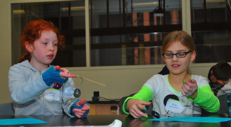 Lincoln Public Schools fifth graders (from left) Alora Schneider and Erin Geschweder build balance toys during Saturday Science on Feb. 1.