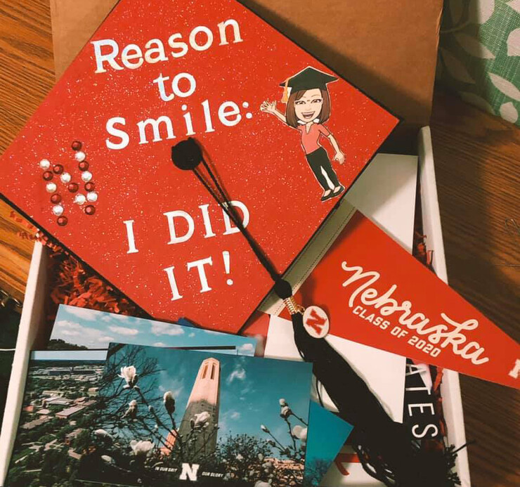 Christa Rahl's Facebook post included this photo of her decorated cap and items she received in the special Go Big Grad box which was sent to every student who earned a degree in May.