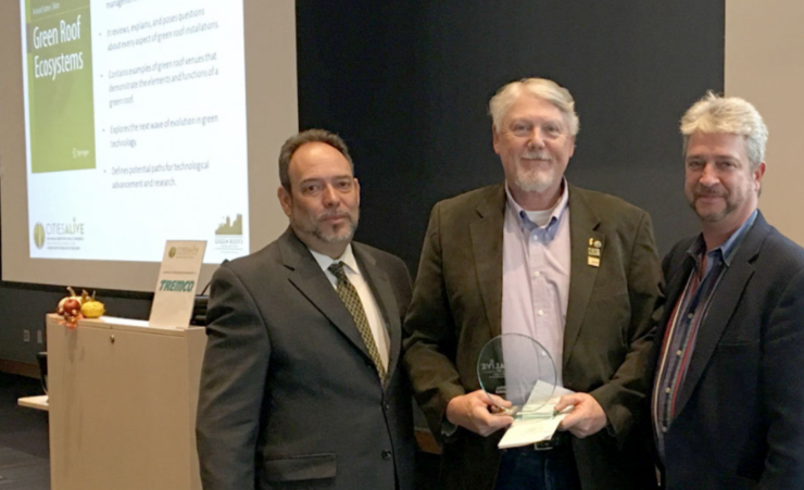 Richard Sutton accepts the Green Roof Excellence Award for Research during the 2016 Cities Alive Conference in Washington, D.C.