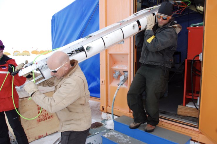 Nebraska researchers, including Bob Zook (left), unload the Deep SCINI submersible during a previous drill season in Antarctica. The latest version of the remote operated vehicle is designed to go deeper than all previous designs.