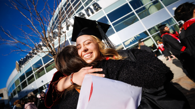 Marissa Heimes, a nutritional science and dietetics graduate, hugs a friend following commencement on Dec. 17.