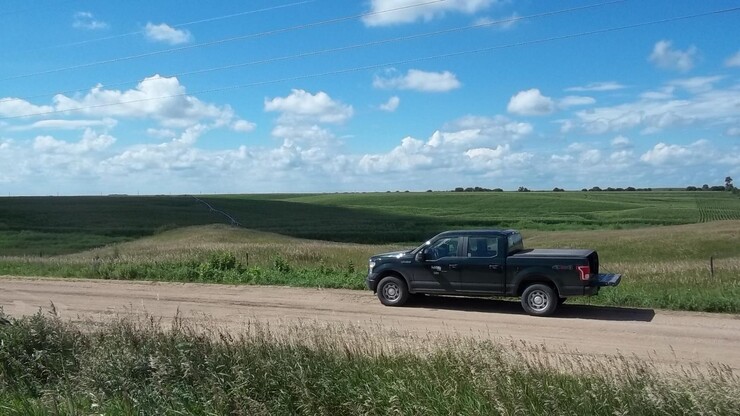 Truck next to field in Nebraska countryside