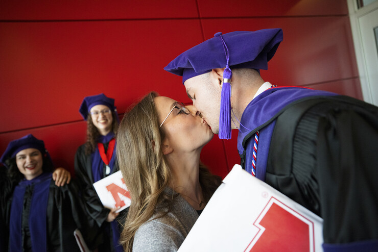 Grant Jones, kissed his wife, Mikayla, following the ceremony. Mikayla will be a third-year Nebraska Law student in the fall.