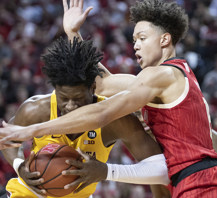 Nebraska's Isaiah Roby smothers Minnesota's Daniel Oturu during a drive to the basket. The Huskers broke a seven game losing streak with a 62-61 victory over the Golden Gophers.
