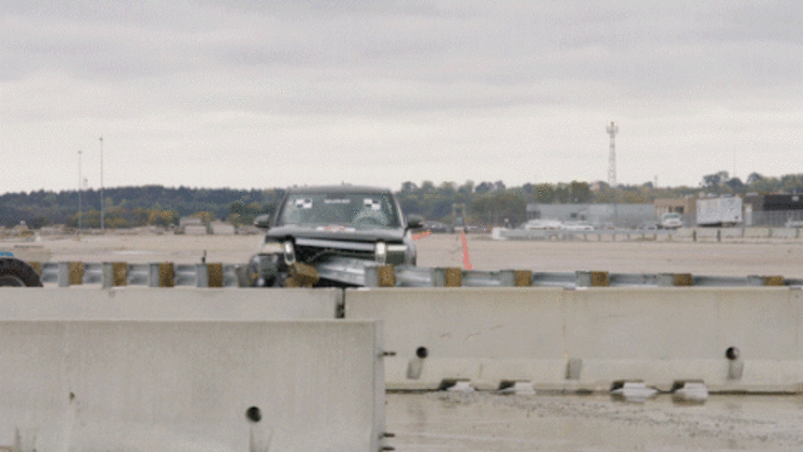 Animated gif showing an electronic vehicle crashing into a roadside barrier