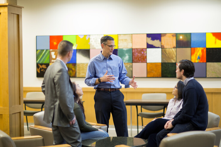 Richard Moberly, interim dean of the University of Nebraska's Law College, talks with students in McCollum Hall. The college is partnering with other Nebraska universities to recruit incoming college freshmen from outstate Nebraska to pursue legal careers.