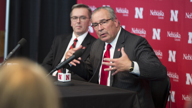 Bill Moos, Nebraska's new director of athletics, talks during an Oct. 15 press conference in Memorial Stadium. The new hire was announced by Chancellor Ronnie Green (left).