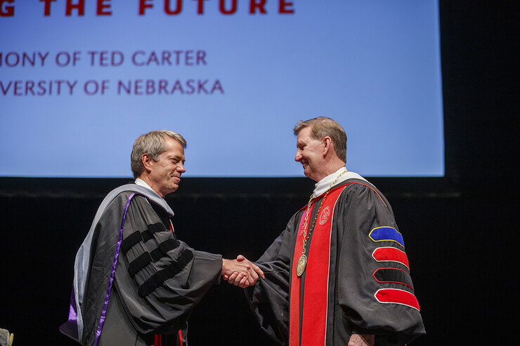 President Ted Carter, right, receives congratulations from Nebraska Regents Chair James D. Pillen after Carter was given the President's medallion. Nebraska University President Ted Carter investiture ceremony. August 14, 2020. Photo by Craig Chandler / University Communication.
