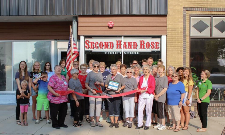 Kaylee Burnside and Clare Umutoni, Rural Fellows working with the Ord Area Chamber of Commerce, attend Second Hand Rose’s ribbon-cutting to celebrate its new storefront.