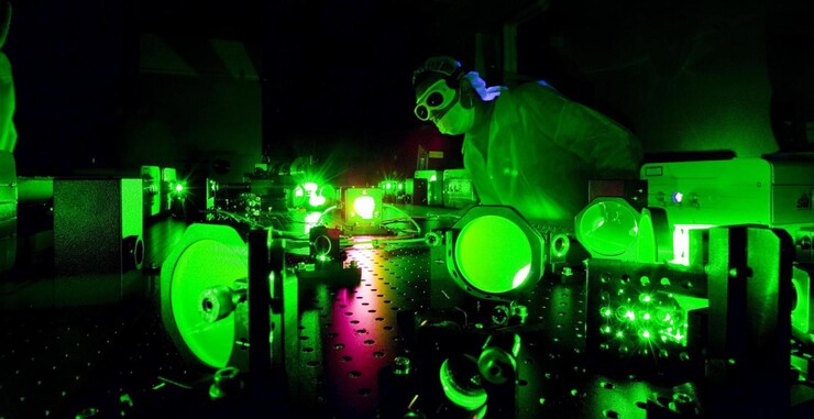A researcher working in Nebraska’s Extreme Light Laboratory, where experiments recently demonstrated certain scattering behaviors in high-intensity light for the first time.
